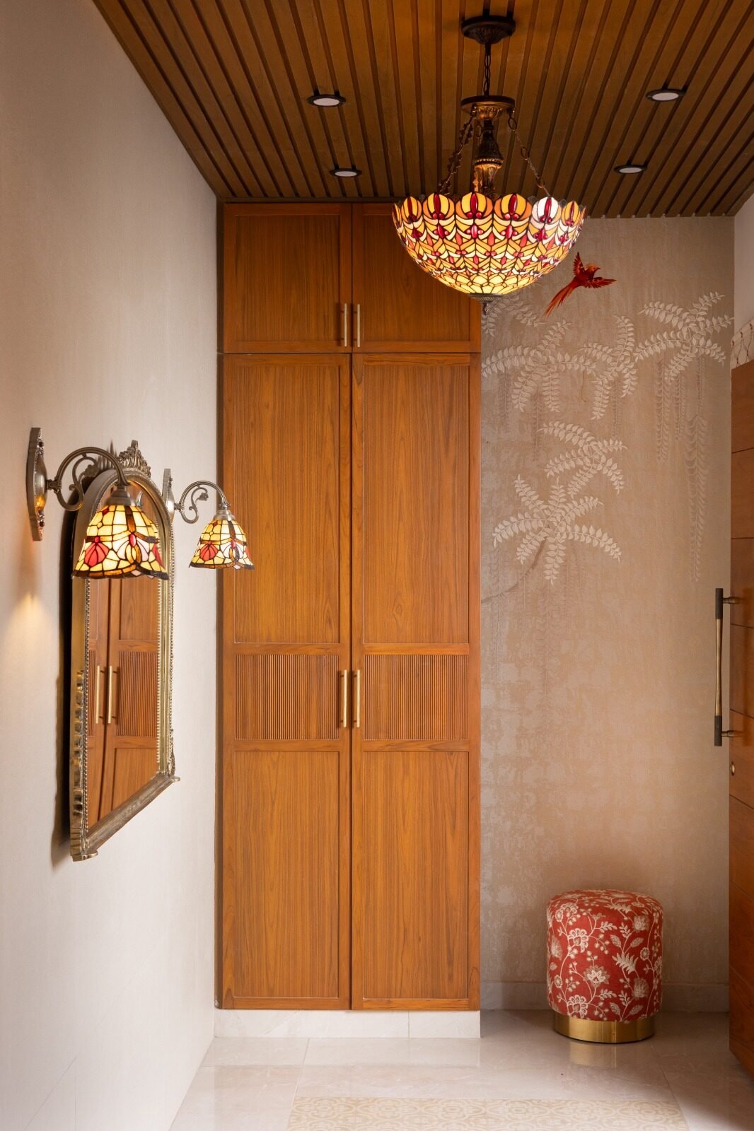 Entrance wall with teak wardrobe and dressing mirror