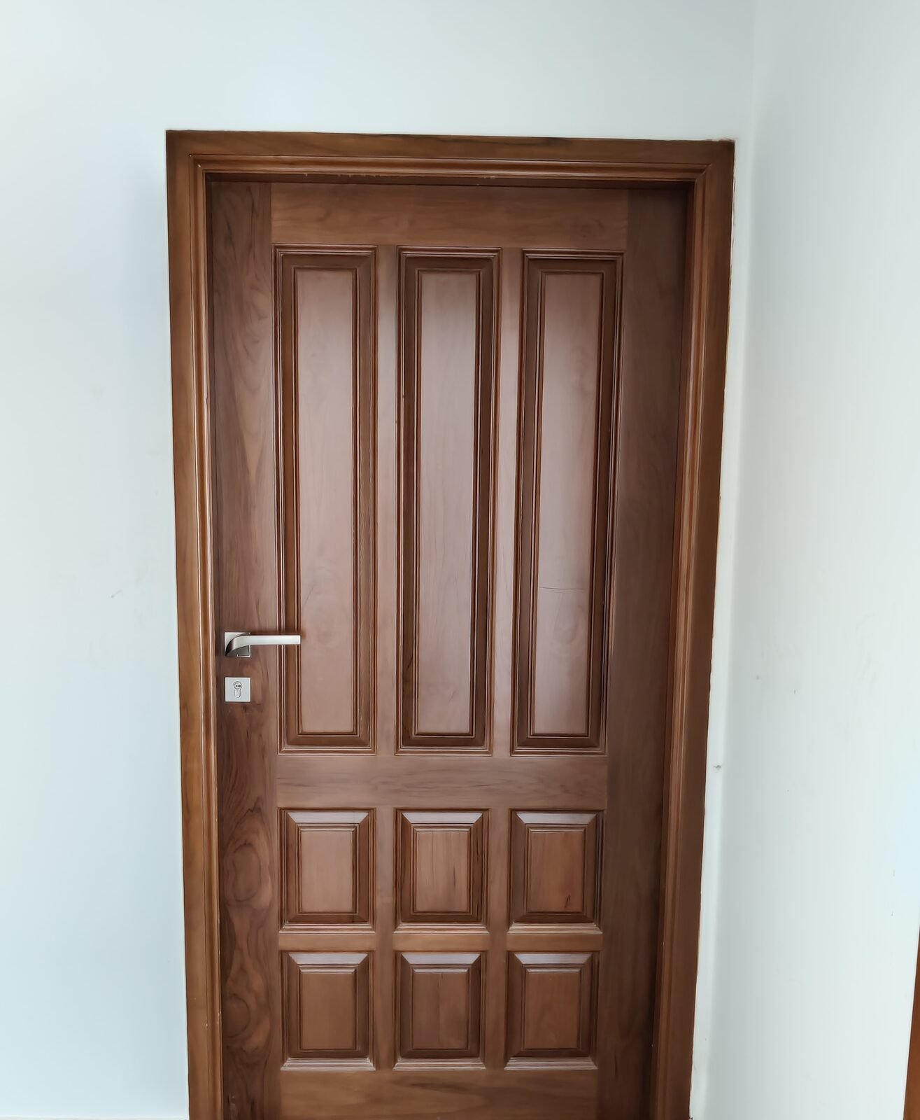 Solid panelled teak entrance door